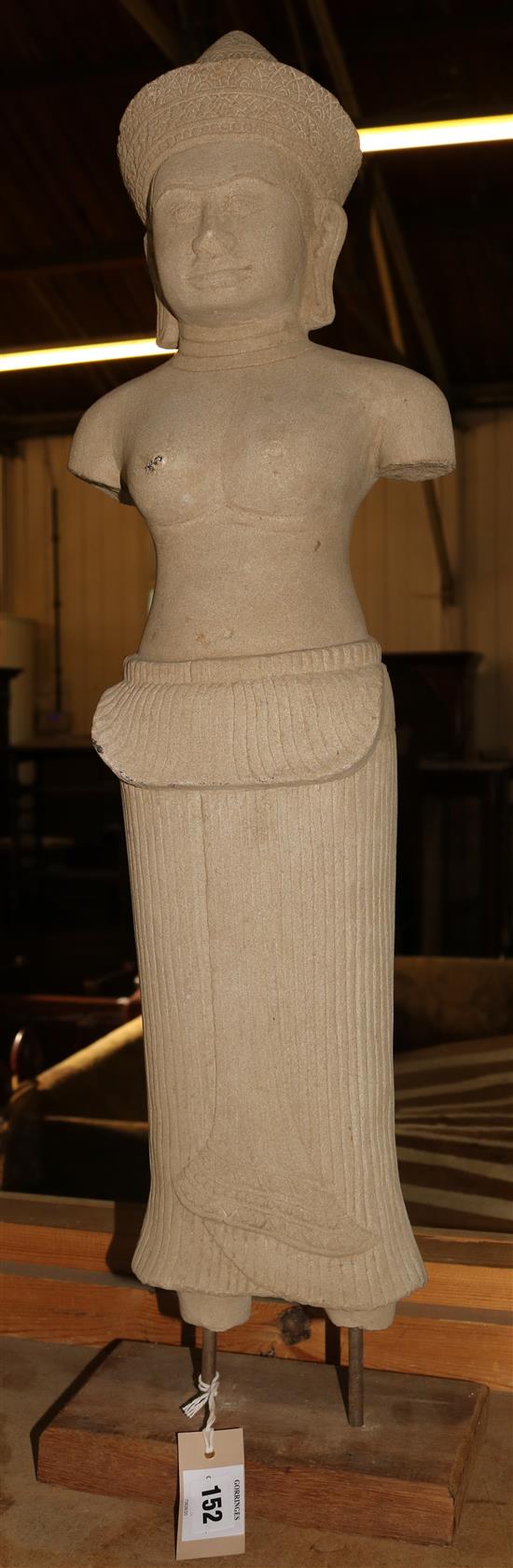 A Cambodian carved stone female figure, overall height 2ft 7in.(-)